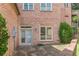 Brick home exterior showcasing a back patio area at 1829 Buckhead Valley Ne Ln, Atlanta, GA 30324