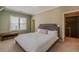 Bright bedroom featuring a king-size bed and access to upper hallway at 1829 Buckhead Valley Ne Ln, Atlanta, GA 30324