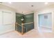 Upstairs hallway with neutral paint and a chandelier at 1829 Buckhead Valley Ne Ln, Atlanta, GA 30324