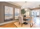 Elegant dining room features a round table with four chairs, hardwood floors, and large artwork at 1829 Buckhead Valley Ne Ln, Atlanta, GA 30324