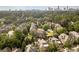 Aerial view of upscale homes nestled in a treelined community, showcasing a stunning cityscape at 1829 Buckhead Valley Ne Ln, Atlanta, GA 30324