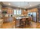Open concept kitchen with island, stainless steel appliances, and hardwood floors at 1829 Buckhead Valley Ne Ln, Atlanta, GA 30324
