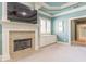 Sitting room with fireplace, built-in shelving, and large TV at 1829 Buckhead Valley Ne Ln, Atlanta, GA 30324