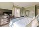 Spacious bedroom with a king-size bed and built-in TV at 1829 Buckhead Valley Ne Ln, Atlanta, GA 30324