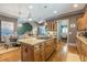 Island kitchen features granite countertops, stainless steel appliances, and hardwood floors at 1829 Buckhead Valley Ne Ln, Atlanta, GA 30324