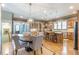 Open kitchen boasts wood cabinetry, stainless steel appliances, and an island with seating at 1829 Buckhead Valley Ne Ln, Atlanta, GA 30324
