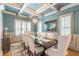 Spacious dining room with coffered ceiling and elegant chandelier at 1829 Buckhead Valley Ne Ln, Atlanta, GA 30324