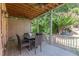 Covered deck with wooden flooring and outdoor dining furniture at 1829 Buckhead Valley Ne Ln, Atlanta, GA 30324
