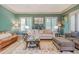 Spacious living room with hardwood floors, comfortable seating, and large windows at 1829 Buckhead Valley Ne Ln, Atlanta, GA 30324