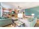 Living room with stone fireplace, built-in shelving and hardwood floors at 1829 Buckhead Valley Ne Ln, Atlanta, GA 30324