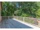 Spacious deck with wooden flooring, overlooking a lush green backyard at 1829 Buckhead Valley Ne Ln, Atlanta, GA 30324