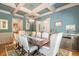 Bright dining room features a coffered ceiling and hardwood floors at 1829 Buckhead Valley Ne Ln, Atlanta, GA 30324