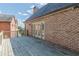 Brick home exterior with deck, offering views of neighboring houses at 1829 Buckhead Valley Ne Ln, Atlanta, GA 30324
