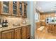 Butlers pantry with granite countertops and glass-front cabinets at 1829 Buckhead Valley Ne Ln, Atlanta, GA 30324