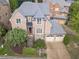 Brick home with gray roof, two-car garage, and landscaping at 1829 Buckhead Valley Ne Ln, Atlanta, GA 30324