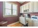 Bright home office with built-in cabinetry, hardwood floors and window with blinds at 1829 Buckhead Valley Ne Ln, Atlanta, GA 30324