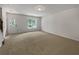 Bright entryway with neutral carpet and staircase leading upstairs at 2812 Deerwood Sw Ln, Atlanta, GA 30331