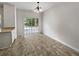 Dining area with tile flooring and sliding glass door leading to the backyard at 2812 Deerwood Sw Ln, Atlanta, GA 30331