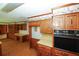 Spacious kitchen with ample cabinetry and built-in desk at 2994 Ravenwolfe Way, Snellville, GA 30039
