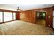 Spacious living room with wood paneling and views to kitchen at 2994 Ravenwolfe Way, Snellville, GA 30039