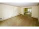 Large living room with carpet and view to dining room at 2994 Ravenwolfe Way, Snellville, GA 30039