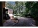 Screened porch, stairs, and wooded backyard at 2994 Ravenwolfe Way, Snellville, GA 30039