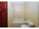 Clean bathroom with a bathtub and toilet at 2994 Ravenwolfe Way, Snellville, GA 30039