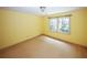 Bright bedroom featuring a large window and neutral colored walls at 2994 Ravenwolfe Way, Snellville, GA 30039