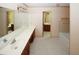Bathroom with double vanity, large mirror and separate shower and bathtub at 2994 Ravenwolfe Way, Snellville, GA 30039