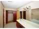 Double vanity bathroom with a large mirror and access to a closet at 2994 Ravenwolfe Way, Snellville, GA 30039