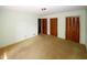 Spacious bedroom featuring built-in closets and carpet flooring at 2994 Ravenwolfe Way, Snellville, GA 30039