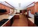 Large kitchen with wood cabinets and tile flooring at 2994 Ravenwolfe Way, Snellville, GA 30039