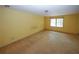Bedroom with neutral walls and window with natural light at 2994 Ravenwolfe Way, Snellville, GA 30039