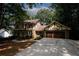 Brick Tudor home with attached garage and basketball hoop at 2994 Ravenwolfe Way, Snellville, GA 30039