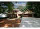 Brick Tudor home with attached garage and basketball hoop at 2994 Ravenwolfe Way, Snellville, GA 30039