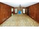 Living room featuring a fireplace and wood paneled walls at 2994 Ravenwolfe Way, Snellville, GA 30039