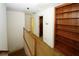 Upper level hallway with built-in shelves and access to bedrooms at 2994 Ravenwolfe Way, Snellville, GA 30039