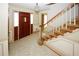 Bright entryway, featuring hardwood staircase and double doors at 2994 Ravenwolfe Way, Snellville, GA 30039