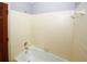 Simple bathroom with a bathtub and tiled walls at 2994 Ravenwolfe Way, Snellville, GA 30039