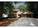 Brick Tudor home with attached garage and basketball hoop at 2994 Ravenwolfe Way, Snellville, GA 30039
