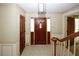 Spacious entryway with hardwood floors and staircase at 2994 Ravenwolfe Way, Snellville, GA 30039