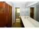Double sink bathroom with built-in storage and access to toilet at 2994 Ravenwolfe Way, Snellville, GA 30039