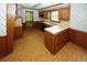 Open kitchen with island and breakfast bar at 2994 Ravenwolfe Way, Snellville, GA 30039