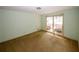 Bright bedroom with large window and neutral carpeting at 2994 Ravenwolfe Way, Snellville, GA 30039
