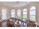 Bright dining room with large windows and modern table setting at 11140 West Rd, Roswell, GA 30075