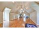 Large bonus room with hardwood floors and high ceilings at 11140 West Rd, Roswell, GA 30075