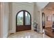 Grand entryway with arched double doors and marble flooring at 11140 West Rd, Roswell, GA 30075