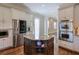 Bright kitchen with granite island, stainless steel appliances, and custom cabinetry at 11140 West Rd, Roswell, GA 30075