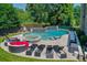 Luxury pool and spa with ample lounge space at 11140 West Rd, Roswell, GA 30075