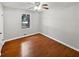 Bright bedroom with hardwood floors and ceiling fan at 1067 Cherry Wood Dr, Lawrenceville, GA 30046